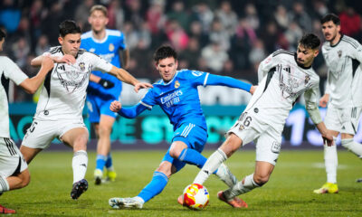 Real Madrid's Franco Mastantuono, center, vies for the ball with Albacete's Antonio Pacheco, second right, during the Copa del Rey round of 16 soccer match between Albacete and Real Madrid, in Albacete, Spain, Wednesday, Jan. 14, 2026. (AP Photo/Jose Breton)
