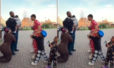 Abroad-Based Nigerian Woman Kneels with Children