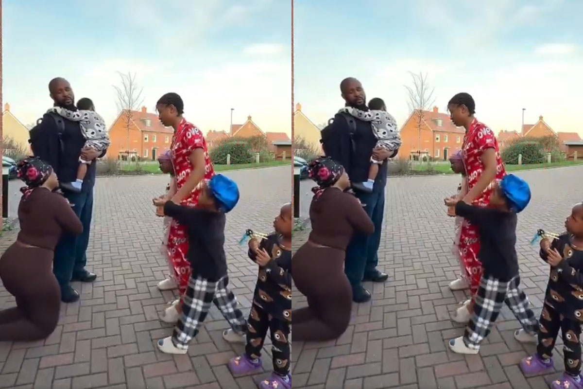 Abroad-Based Nigerian Woman Kneels with Children