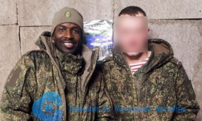 Adamu Abubakar in Russian Army’s uniform flanked by another soldier