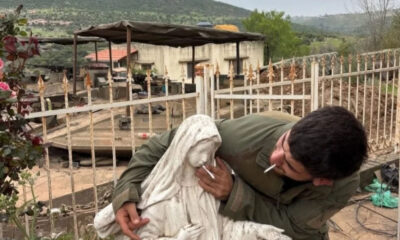 Outrage as Israeli Soldier Poses With Cigarette in Virgin Mary Statue’s Mouth