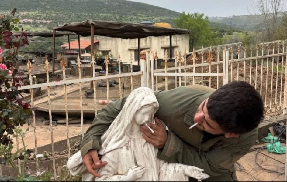 Outrage as Israeli Soldier Poses With Cigarette in Virgin Mary Statue’s Mouth