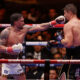 Usyk Defeats Verhoeven via Controversial Stoppage to Retain Heavyweight Titles