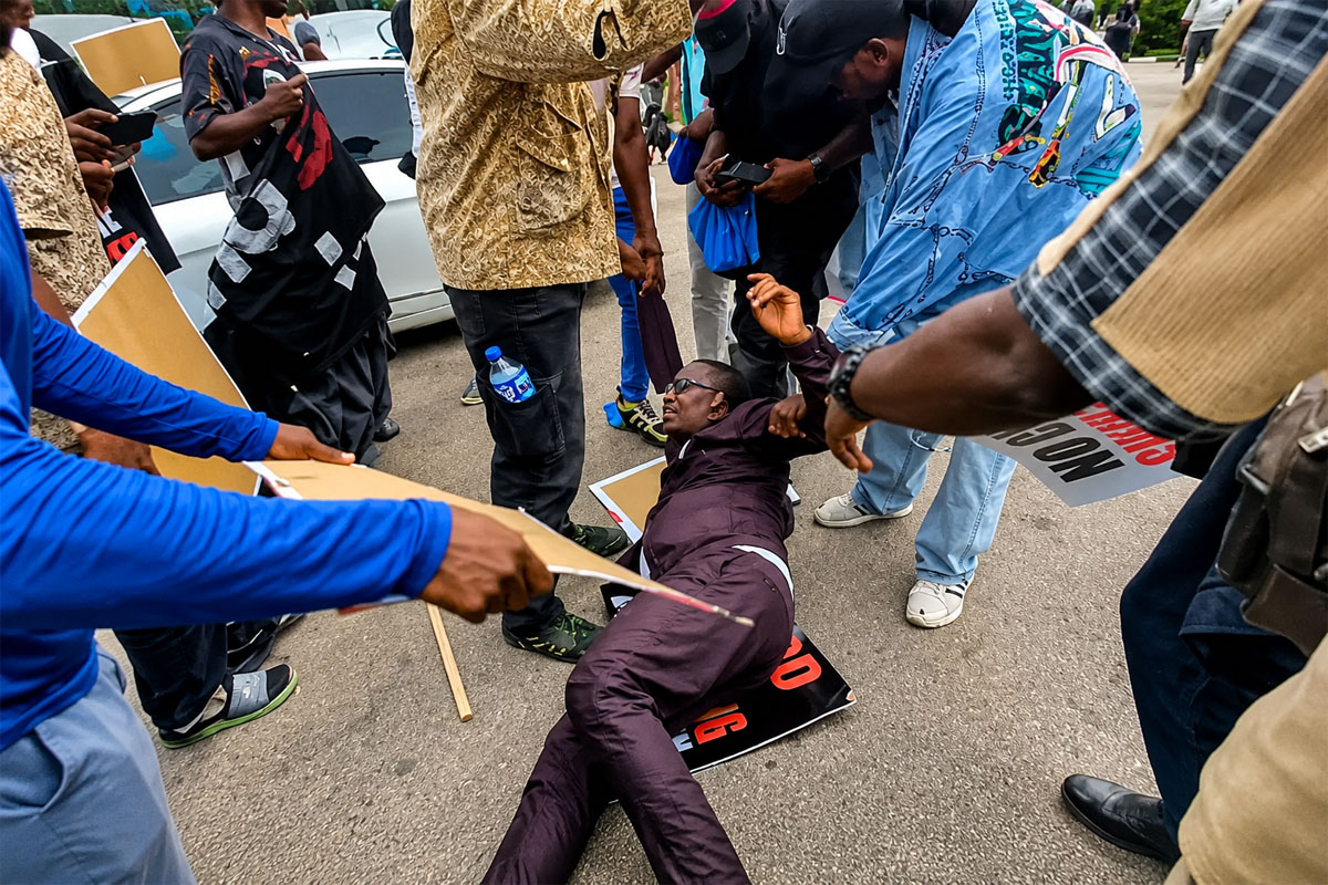 Omoyele Sowore Collapses as Tear Gas Disrupts Democracy Day Protest in Abuja.psd