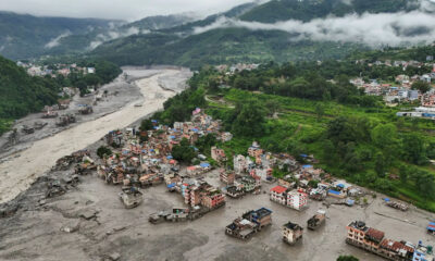 A drone view shows mud covering buildings and property following a flash flood in Trishuli, Nuwakot district, Nepal, on Aug. 27. REUTERS/YONHAP
